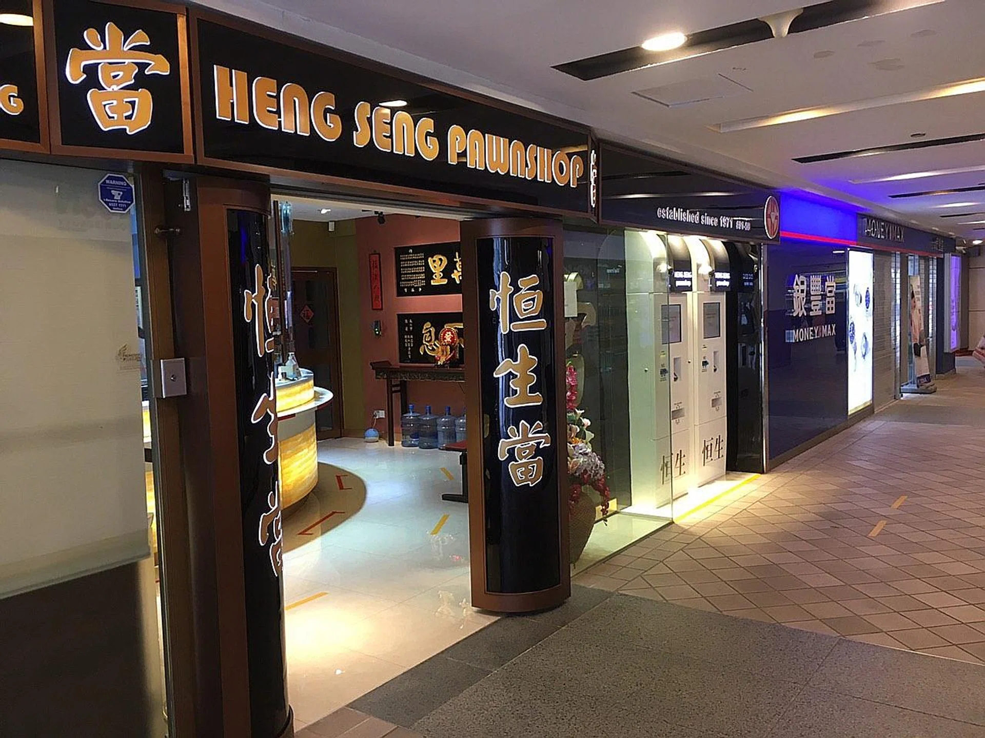 Heng Seng Pawnshop at Toa Payoh Central sees about 100 customers a day now. On Tuesday, business at pawnshops in the area appeared to be brisk.