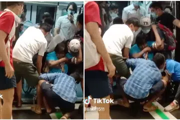 Woman's wheelchair gets stuck in MRT platform gap, commuters rush to help