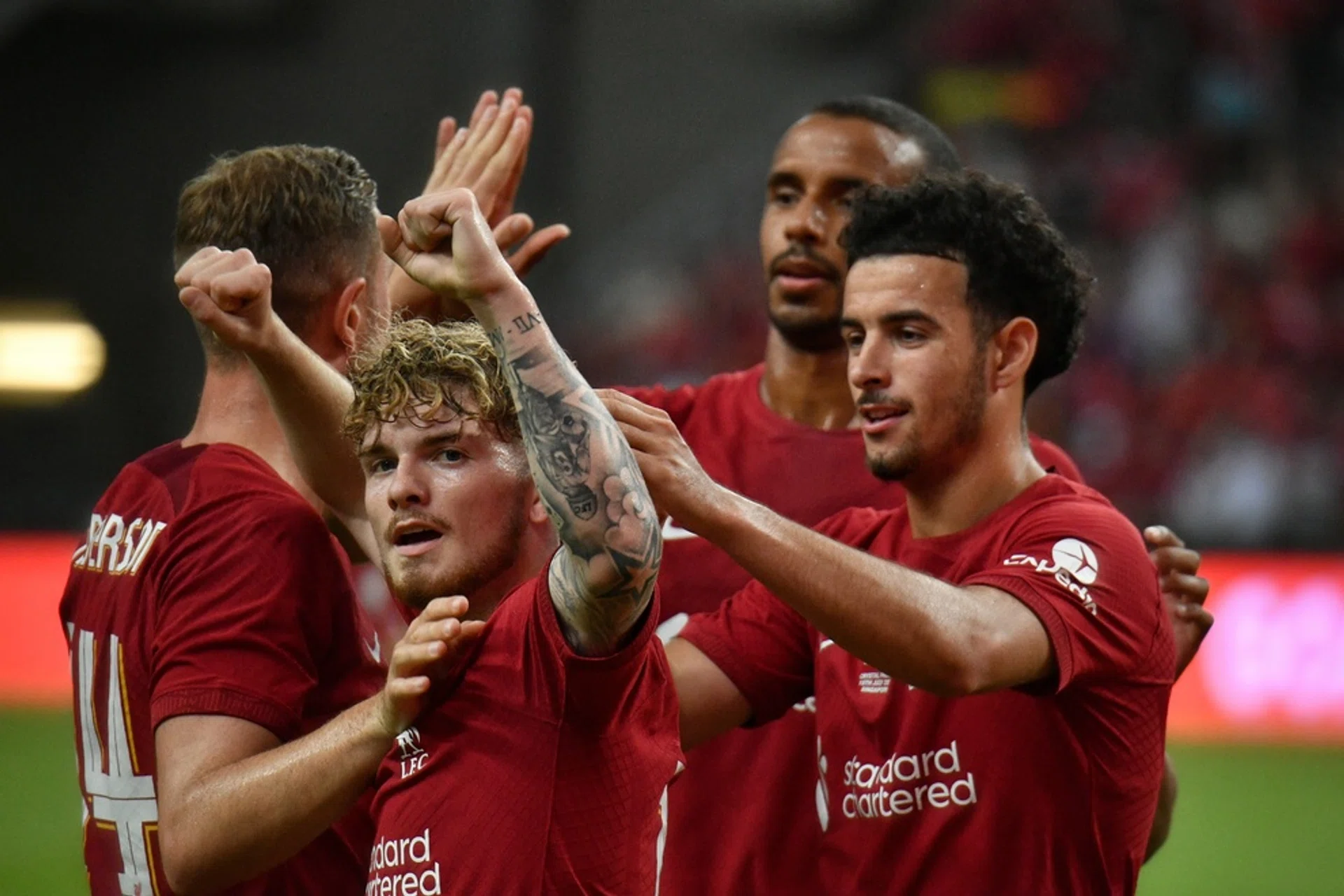 Liverpool players celebrate the first goal of the match against Crystal Palace during the Standard Chartered Singapore Trophy 2022. 
