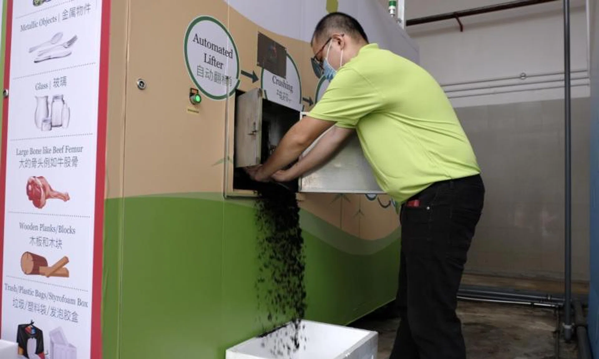 A-Smart Life engineer Lim Yuxin demonstrates the food waste treatment process in Tampines on April 9, 2022.