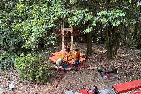 A friend of the couple and Mr Gwee working on an outdoor gazebo in May 2024.