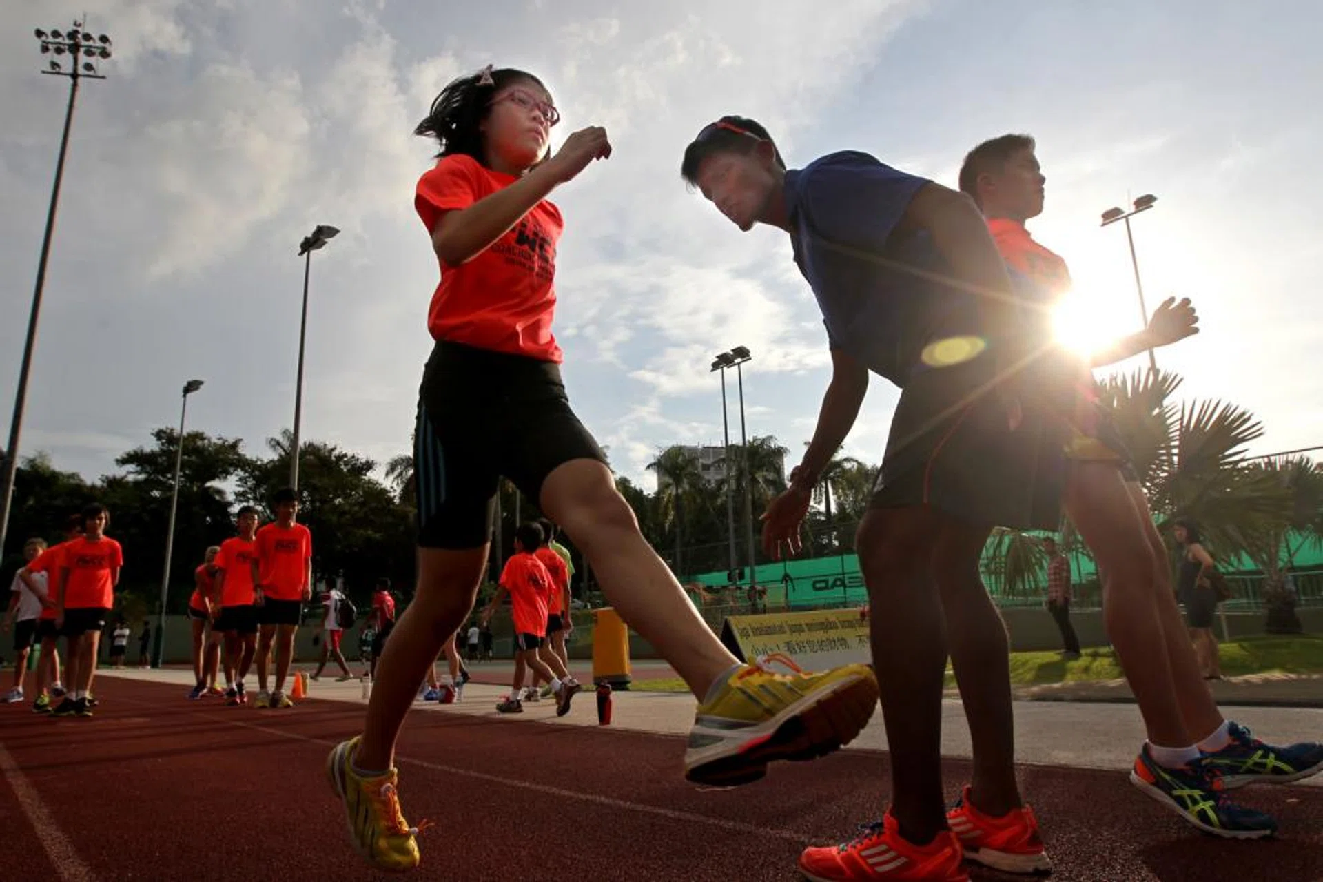 Primary school pupil Rachel Seet training with Mr Fabian William from Fabian Williams Coaching Concepts. He watches her every stride, correcting the budding 100m sprinter’s running posture and technique. Rachel, like several other children now, is put through sports tuition. She is part of a growing trend as parents push their children to excel in sports so that they can enrol in a school through the Direct School Admission (DSA) programme.