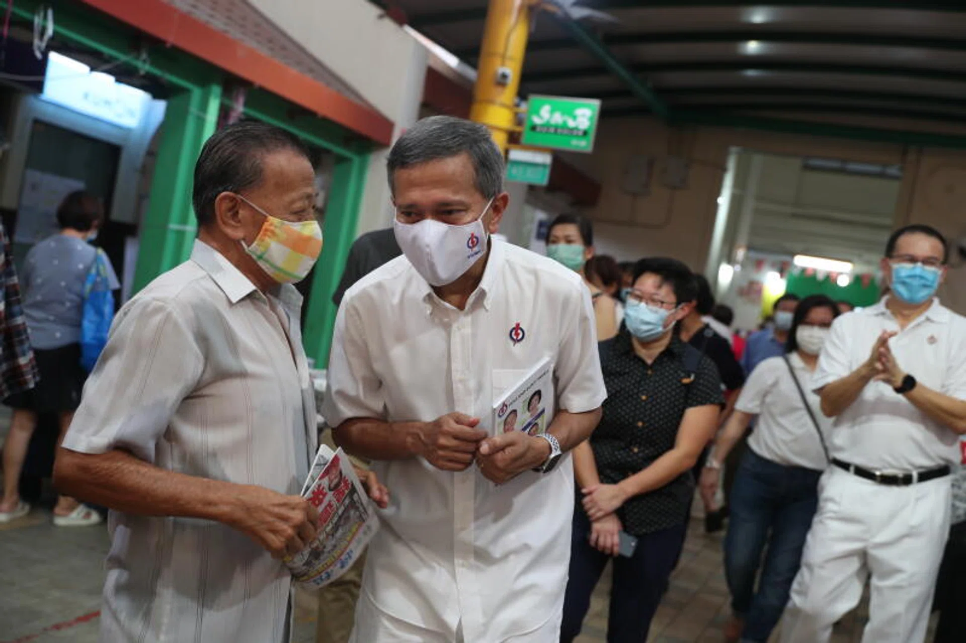 Dr Vivian Balakrishnan, who helms the PAP's Holland-Bukit Timah GRC team, speaking with a resident while on the campaign trail.