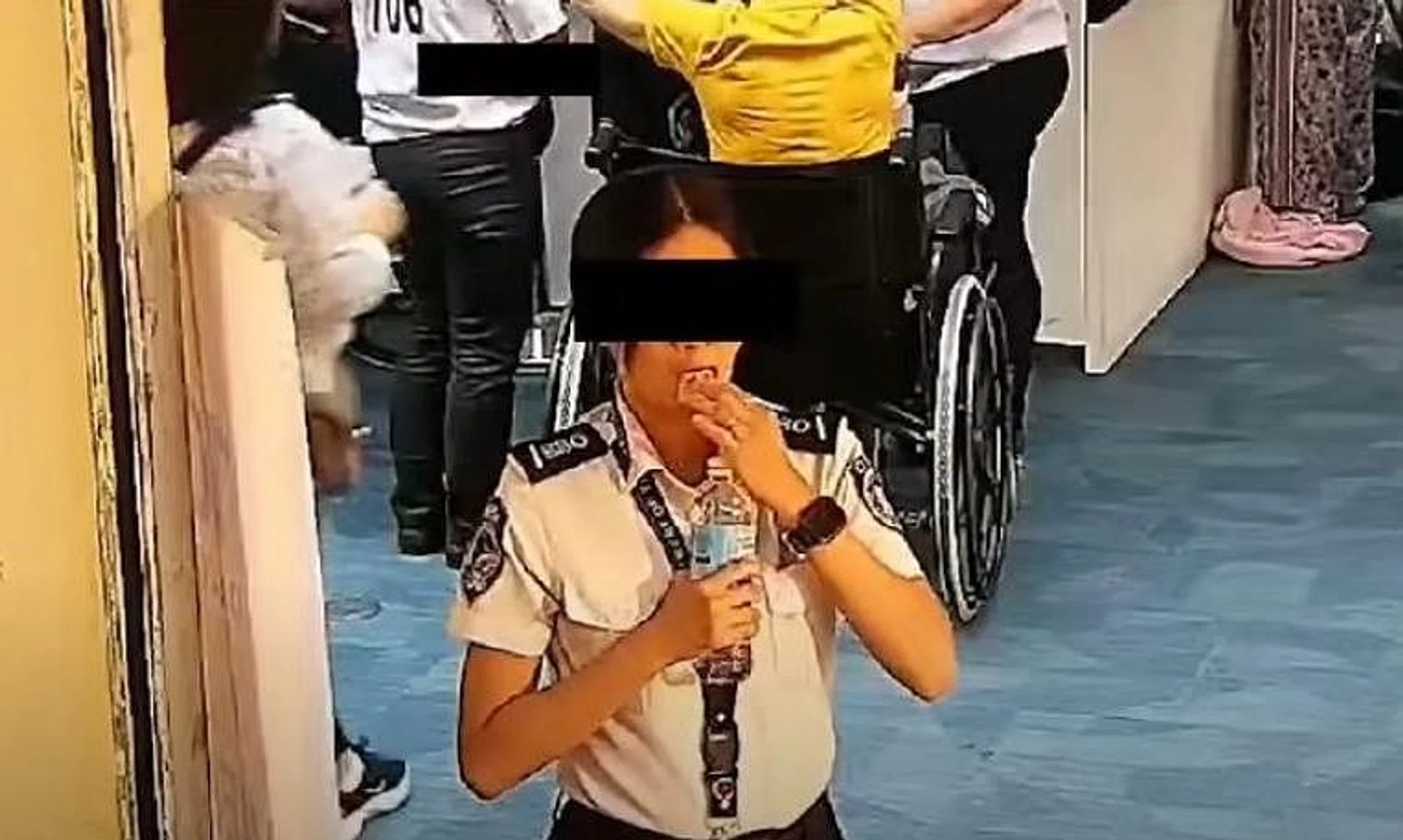 The screening officer did not notice that she had turned towards a security camera as she was stuffing the money into her mouth.