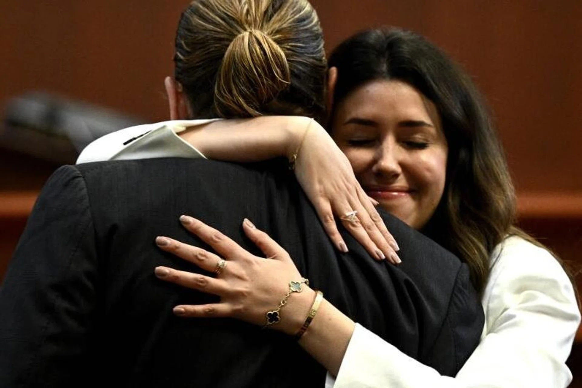 Lawyer Camille Vasquez embraces actor Johnny Depp in the Fairfax County Circuit Courthouse in the US state of Virginia, on May 17, 2022.