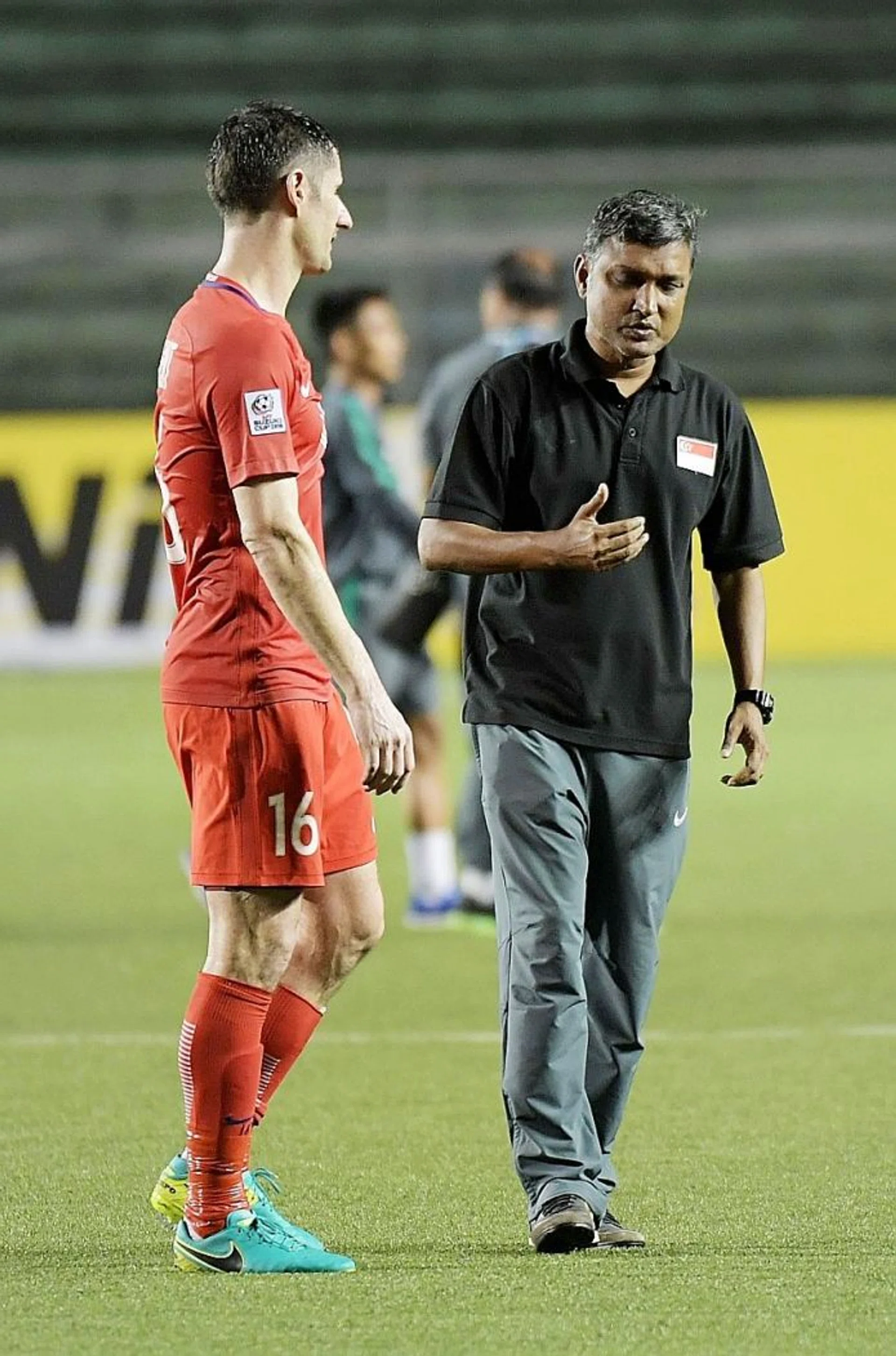 "It hurts. Overall, I believe the boys have done well. They fought until the last minute. On our day, we could have beaten Indonesia." - Lions coach Sundram (above right), with defender Daniel Bennett