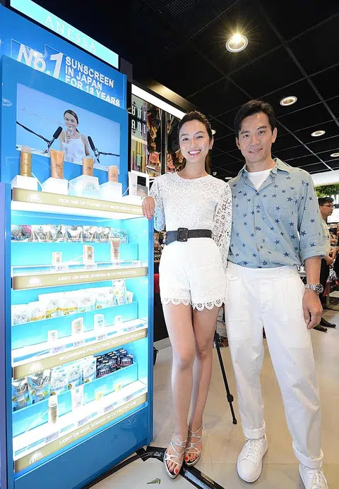 Joanne Peh helps protect hubby's skin from the sun