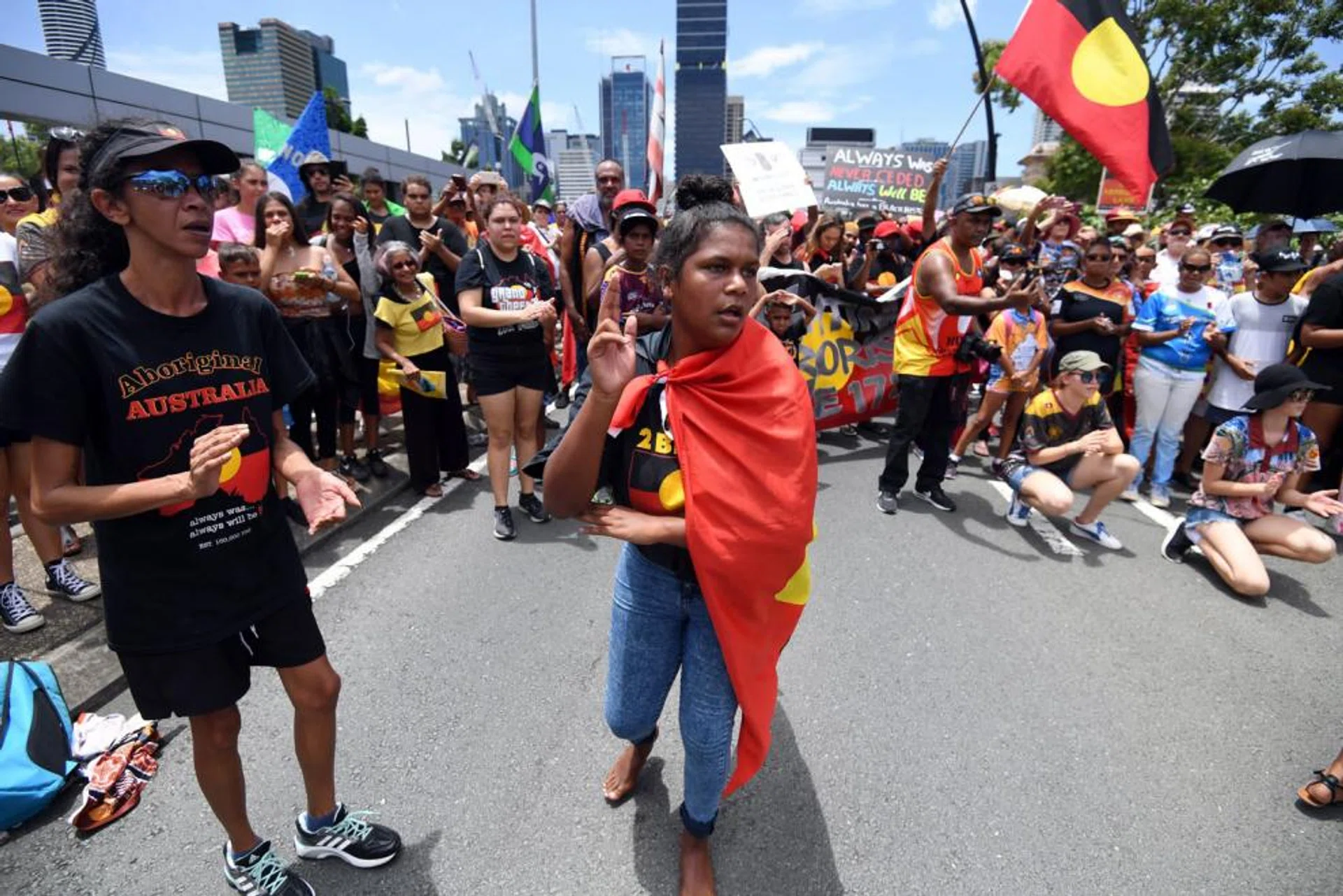 Many people turned up in the aboriginal flag colours to protest against Australia Day being on Jan 26. 