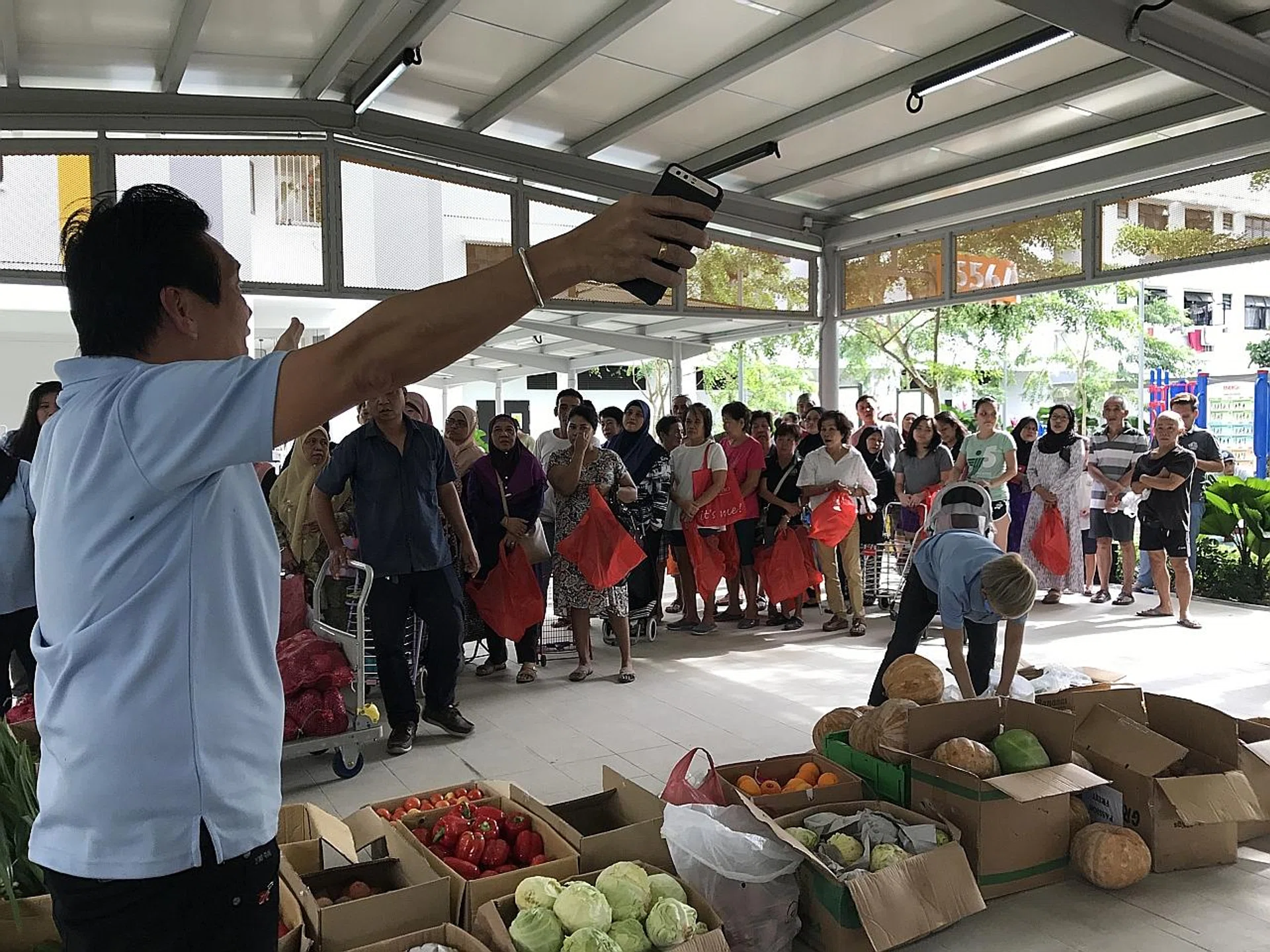 Food being distributed at a Food Bank Singapore event in Bedok. Food waste generated in Singapore has increased by 40 per cent in the last decade.
