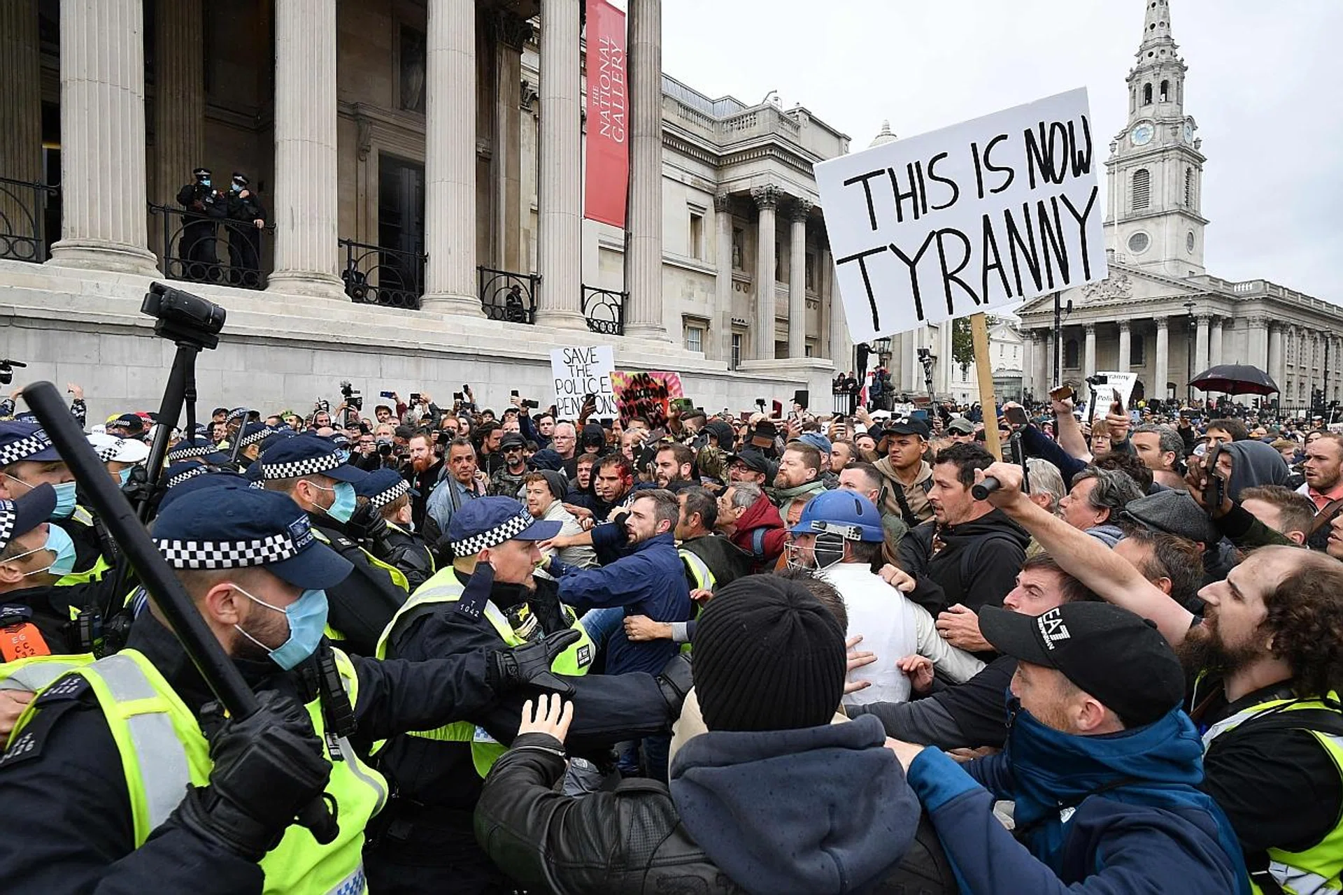 Police dispersing protesters in Trafalgar Square in London on Saturday at a "We Do Not Consent!" rally against vaccination and government restrictions such as the wearing of masks and taking tests for the coronavirus. 