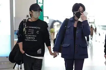 Nicholas Tse and Faye Wong spotted holding hands at China airport