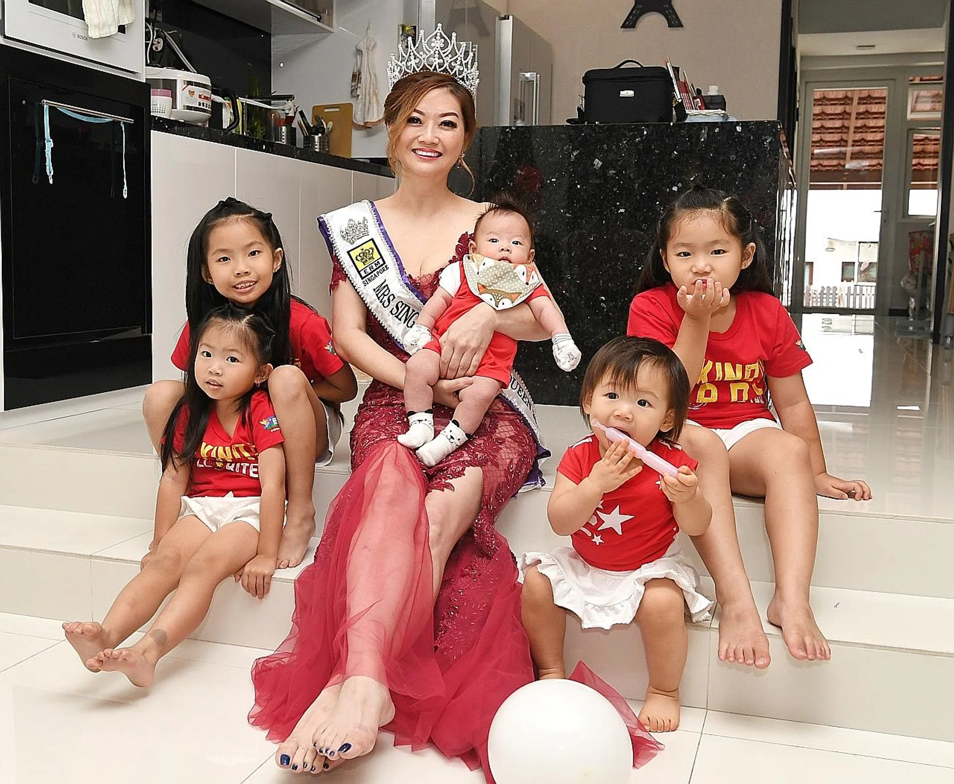 Ms Laura Lee and her grandchildren Fion Ng, Cara Ng, Shane Lian, Scarlett Lian and Celine Ng. 