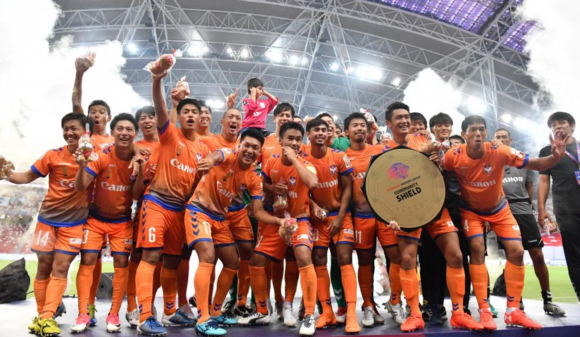 Albirex Niigata celebrating with their Great Eastern Community Shield.