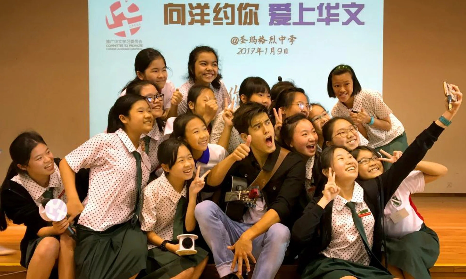Nathan Hartono sang three songs in Mandarin and played charades with the students.