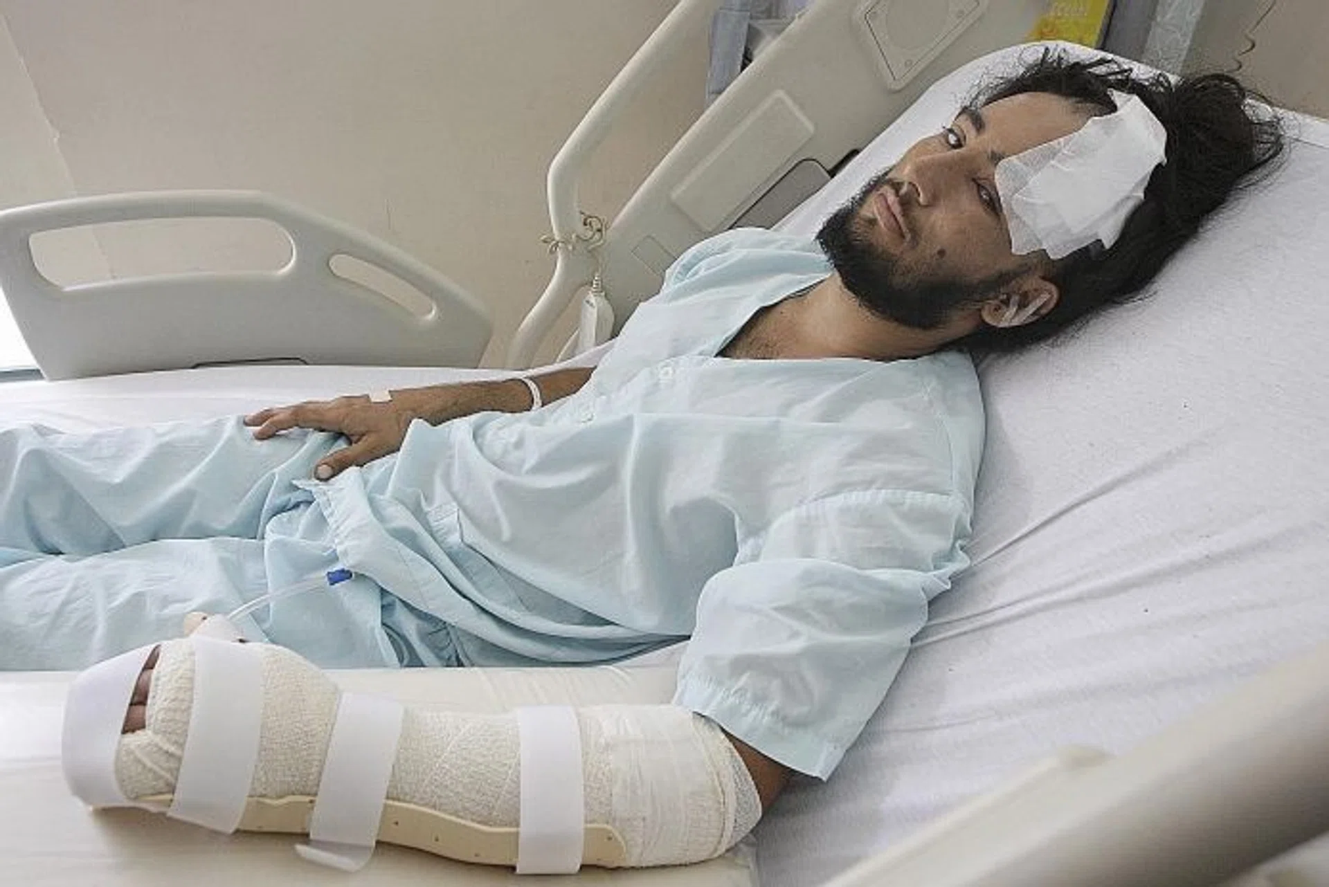 VICTIMS: (Above) Construction worker Sandeep Singh was slashed on his head, left ear, back and left forearm in the early hours of May 30, 2010. He also needed surgery to reattach his fingers. 