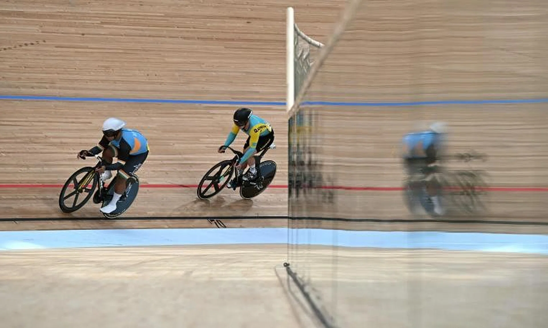 India's David Beckham Elkatohchoongo (left) competes during the individual sprint qualifying at the Asian Games.