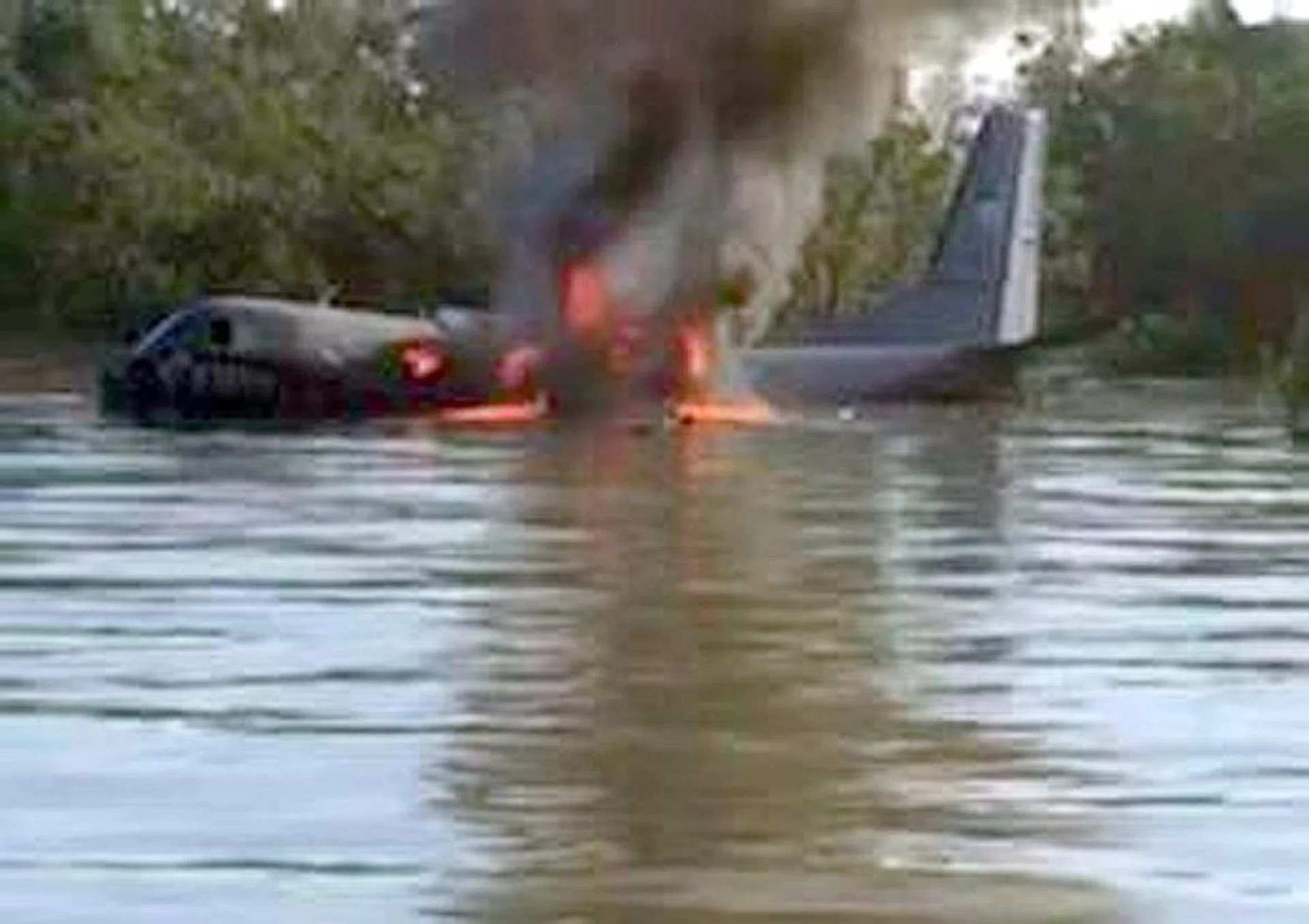 ENGINE FAILURE: The plane crashed near a swampy beach and one of those who went to help drowned after getting stuck in the mud.