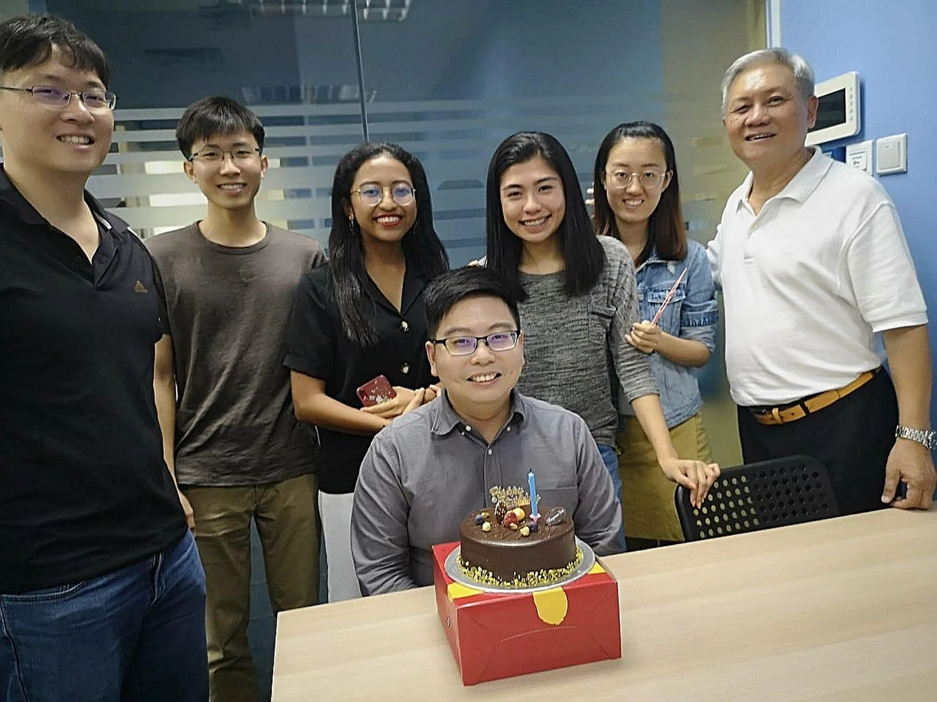 Mr David Lee (right), 67, with his commercial team at MedtechBOSS. 