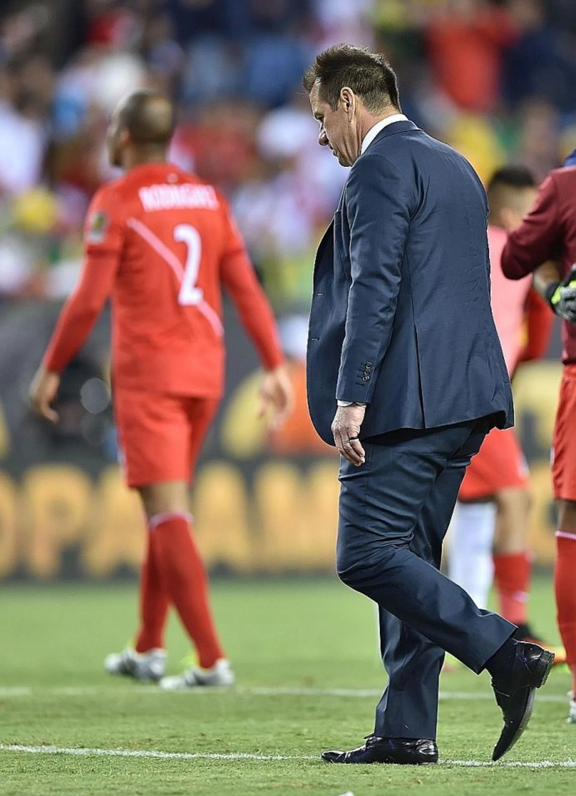 DOWN AND OUT: Brazil coach Dunga (left) has been sacked, no thanks to the disputed goal by Peru's Raul Ruidiaz (above, centre).