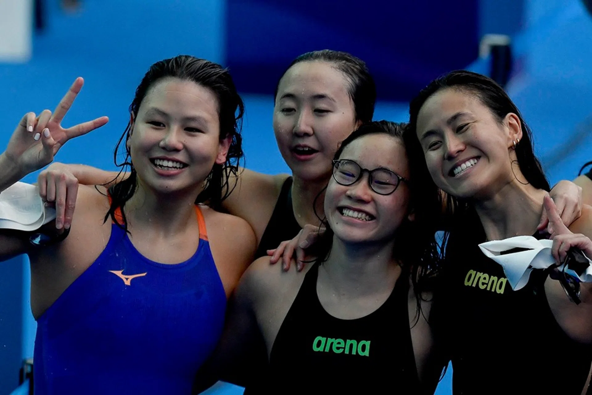 Singapore's 4x200m freestyle quartet of (clockwise, from right) Quah Ting Wen, Gan Ching Hwee, Christie Chue and Quah Jing Wen all smiles after breaking the national record.