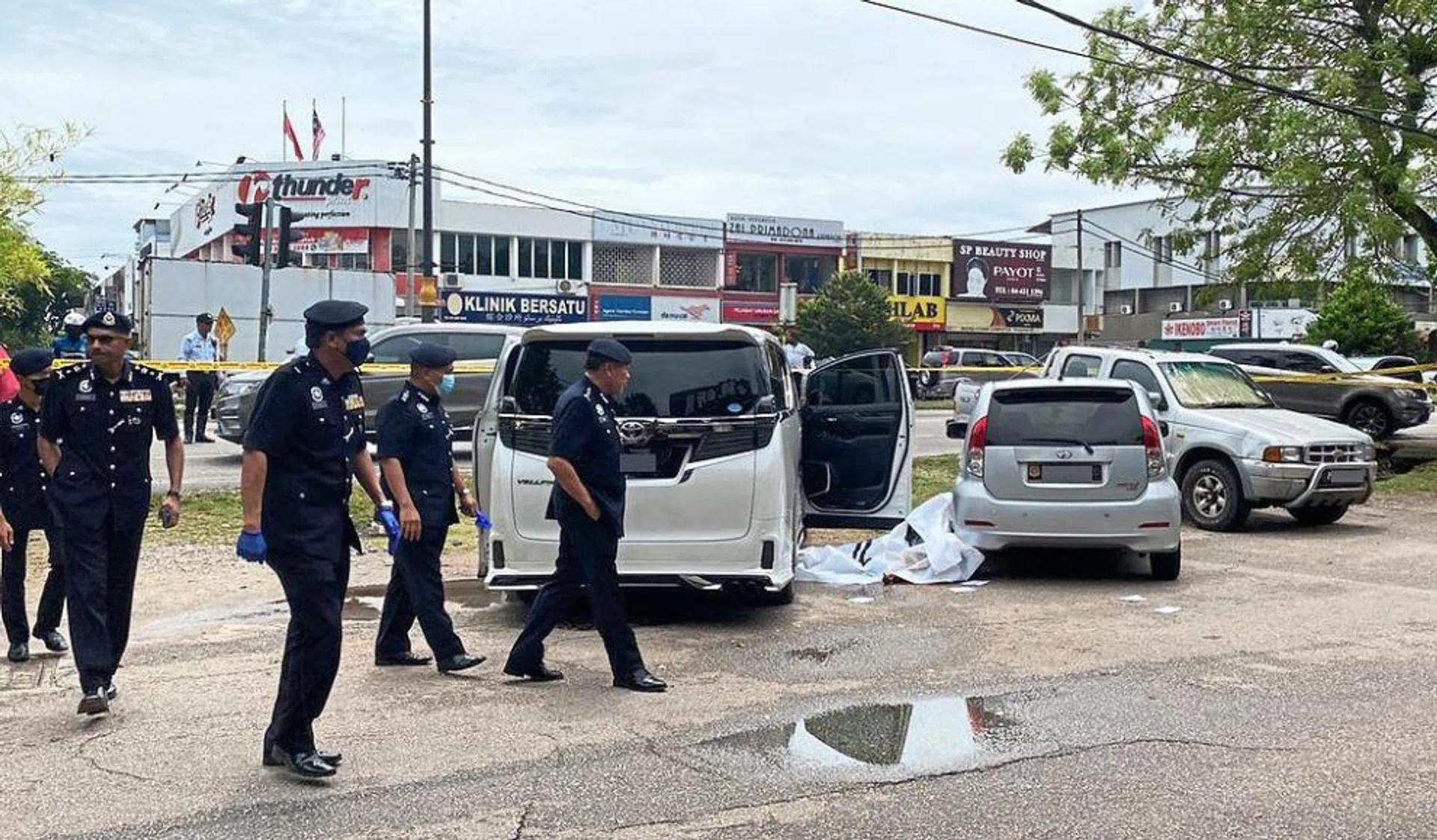 Police looking for clues at the crime scene in Taman Intan, Sungai Petani.