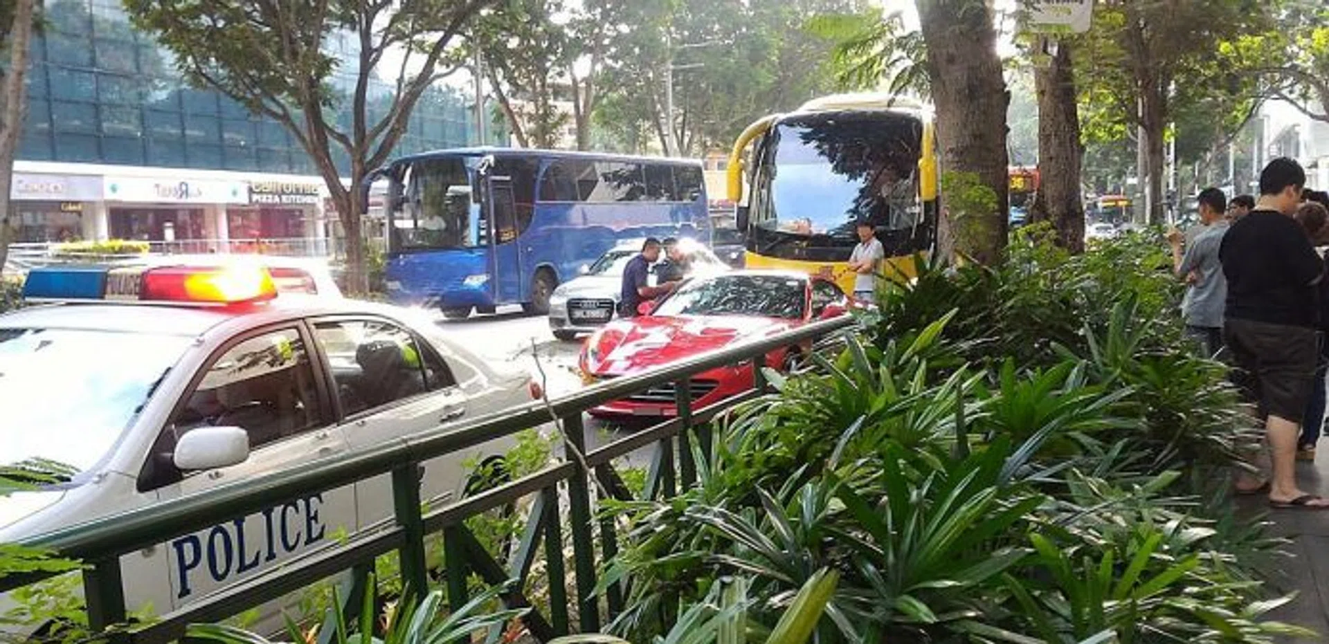 FURIOUS: The Ferrari driver was persuaded to move her car to the left side of the road by the police.