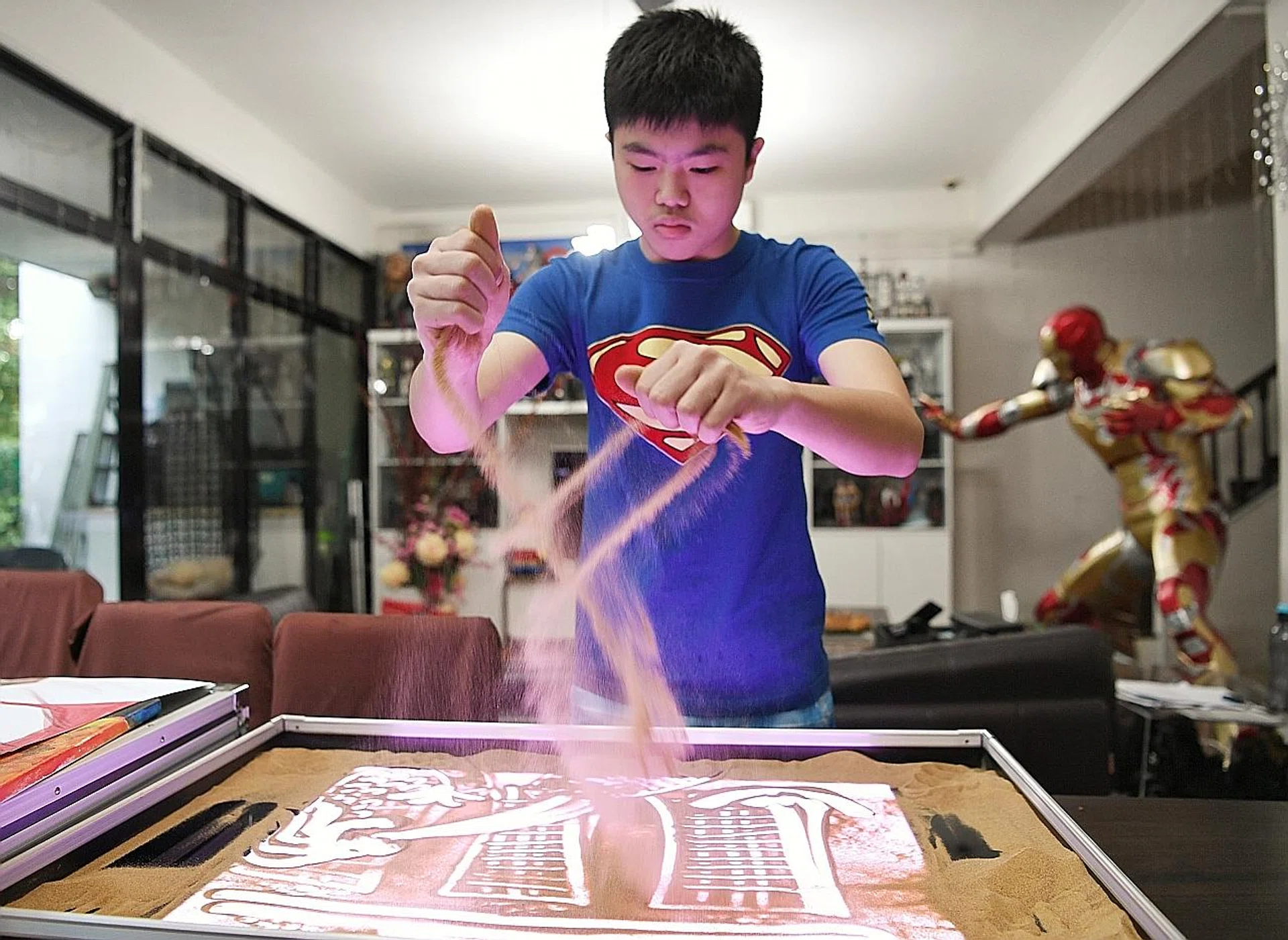 Chalmers Wong has performed sand-art at major events. 