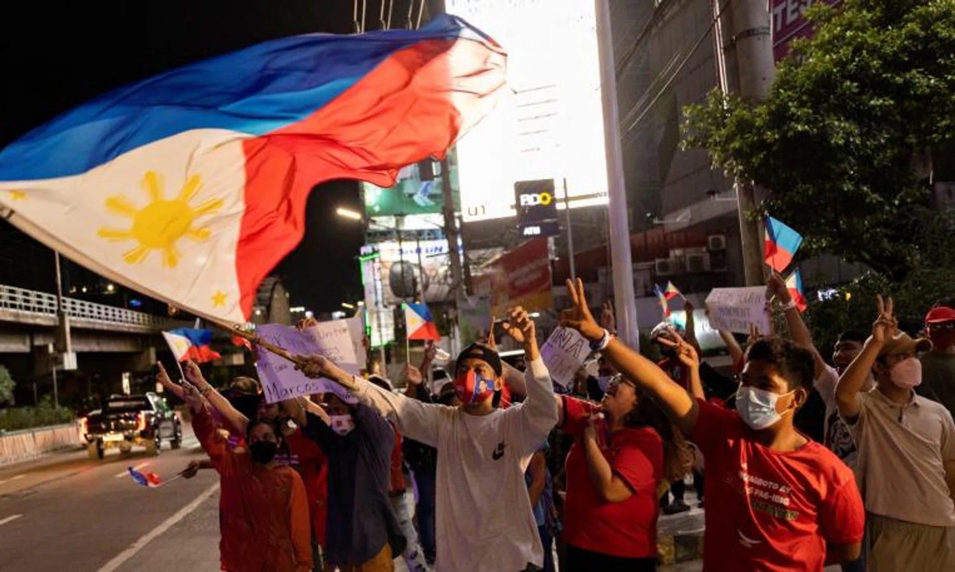 Supporters of presidential candidate Ferdinand Marcos Jr. celebrating after partial results showed him with a wide lead over rivals, in Mandaluyong City, Philippines, on May 9, 2022. 