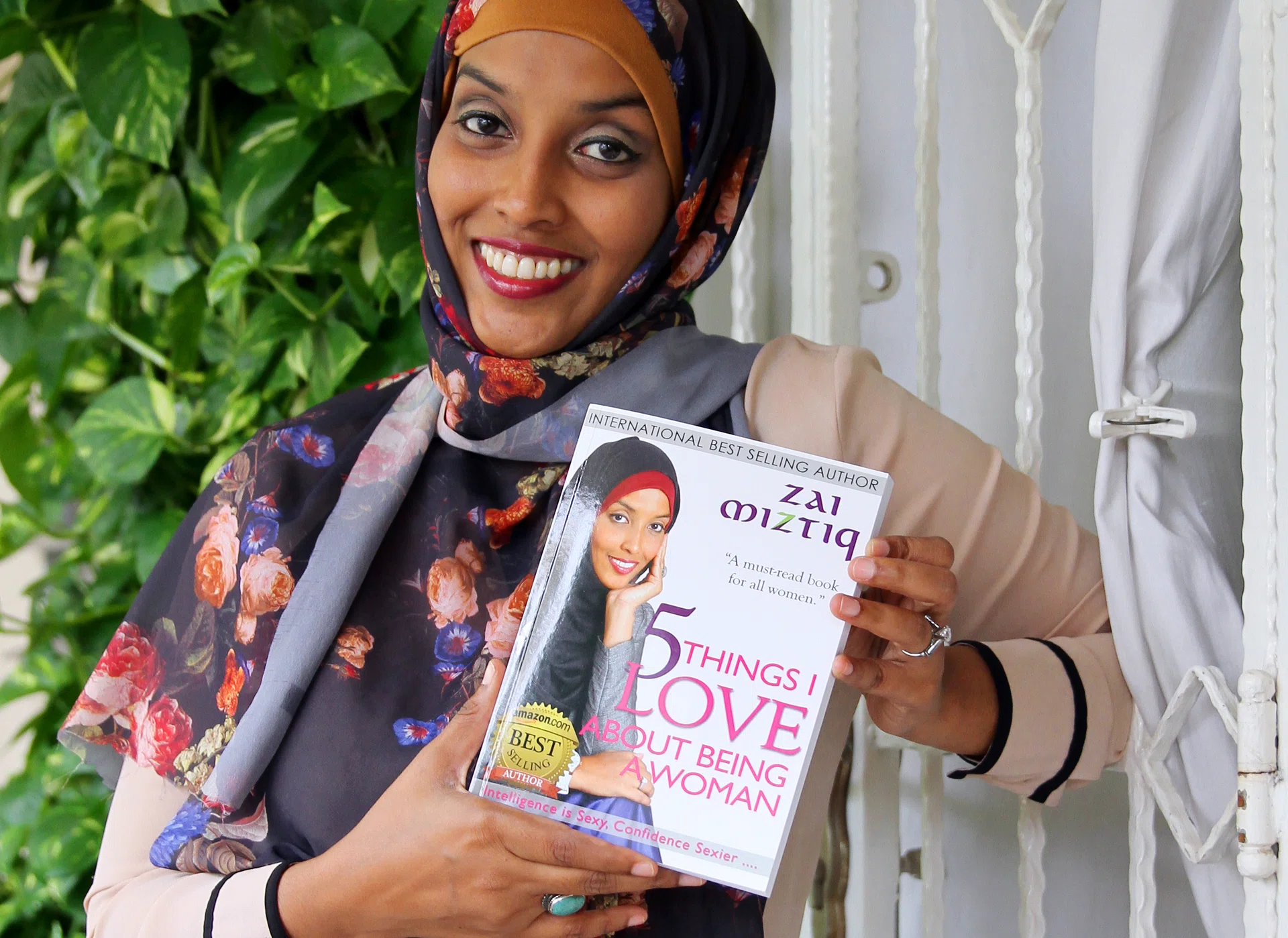 INSPIRING: Ms Zaiton Majeed posing with the book she wrote, 5 Things I Love About Being A Woman.