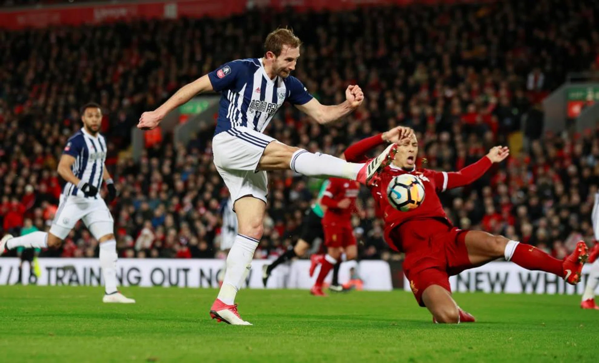 WBA's Craig Dawson putting the ball across goal, causing Joel Matip to score an own goal.