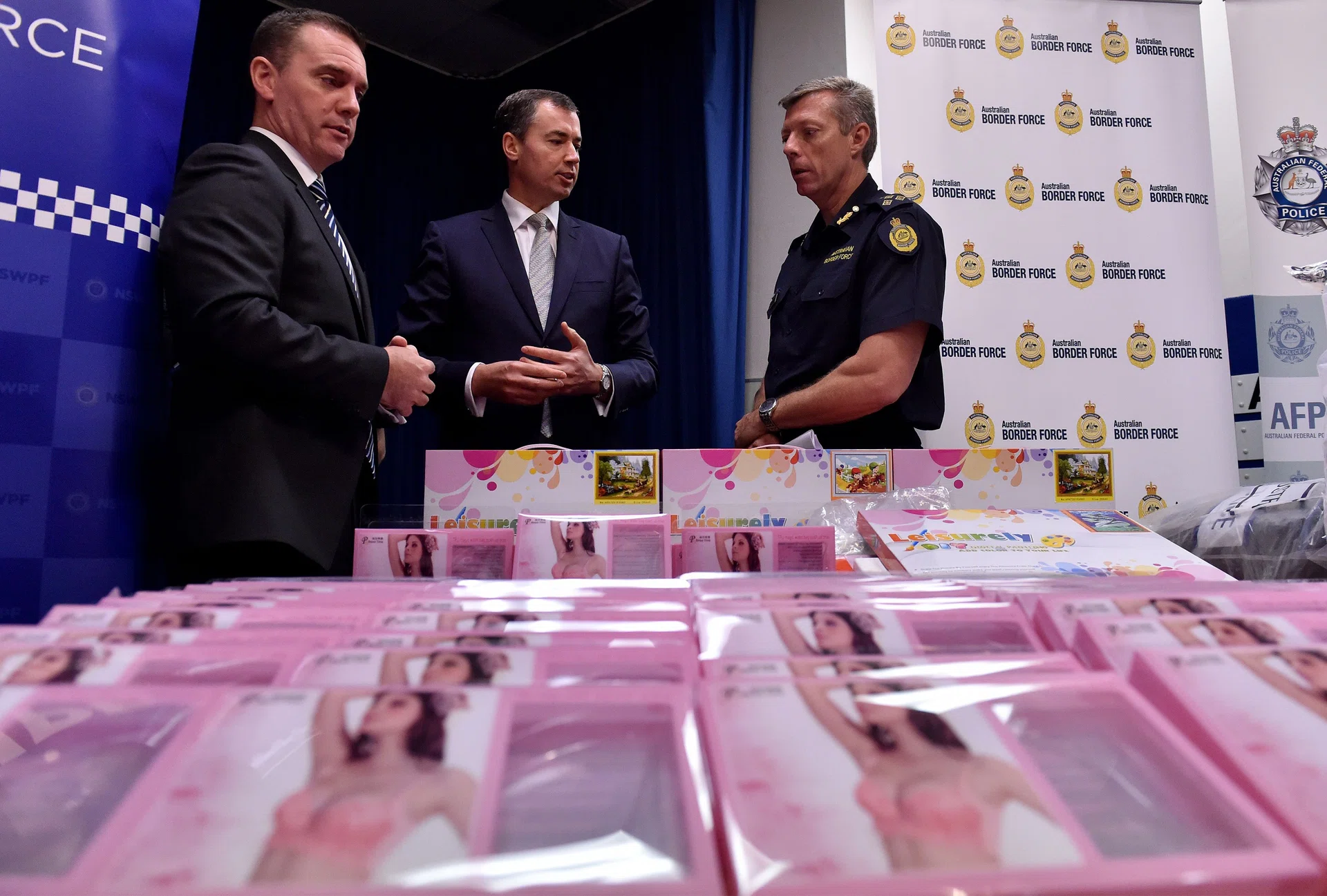 SEIZED: Australian Justice Minister Michael Keenan (centre), with police officials, looking at gel bra inserts containing concealed crystal methamphetamine in one of the country’s biggest drug busts.