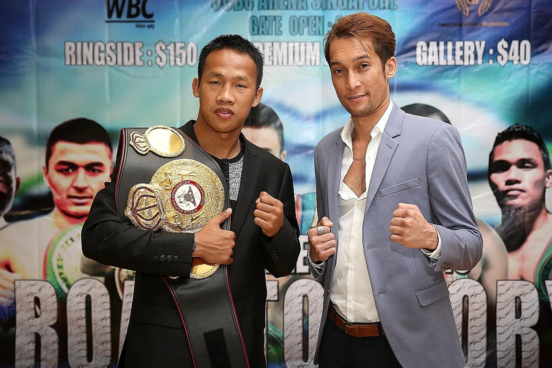 Local boxer Hamzah Farouk (right) posing with Indonesian boxer Daud "Cino" Yordan at the press conference of the WBC-sanctioned Battle of Champions: Road to Glory event yesterday. 