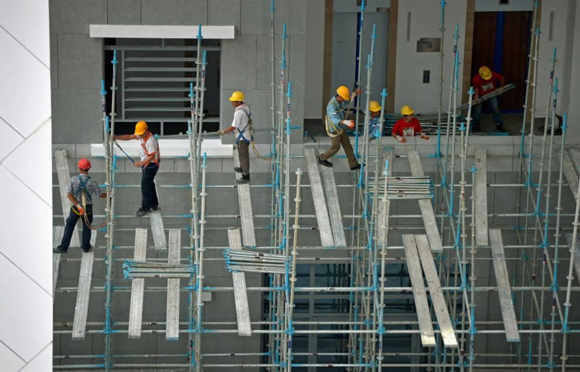 Workers at a construction site along Waterloo Street.