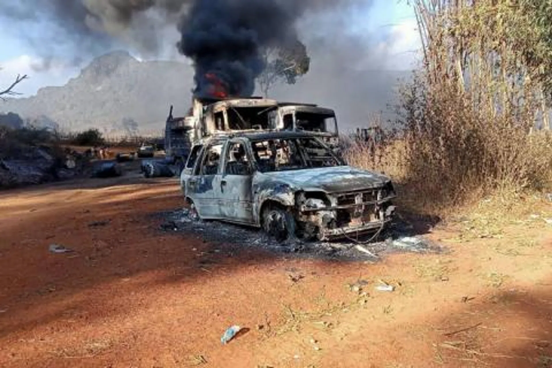 Burned vehicles seen in Hpruso township in Myanmar's Kayah state, on Dec 25, 2021.
