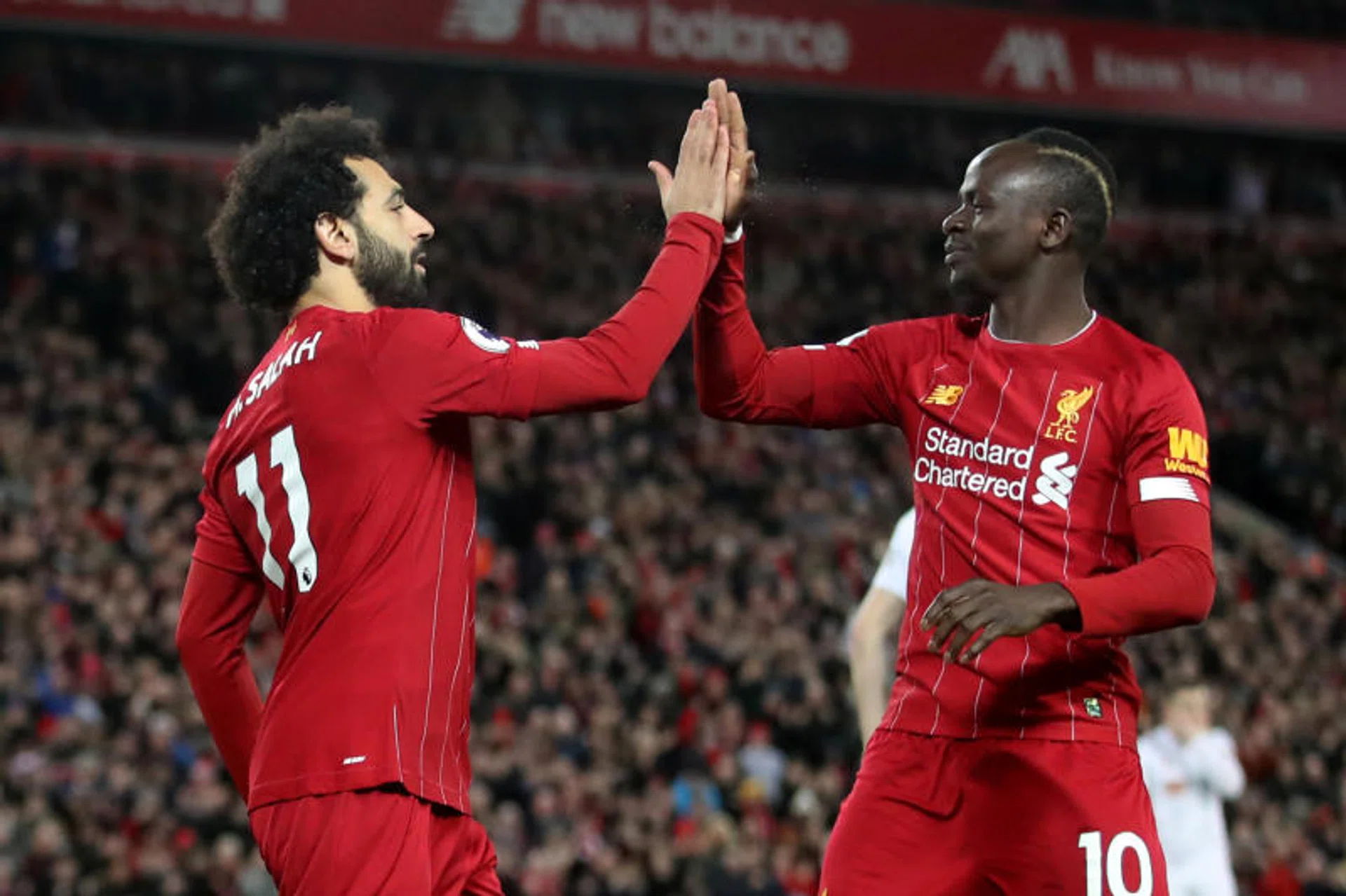 Mohamed Salah (left) celebrating with Sadio Mane after scoring Liverpool's first goal.