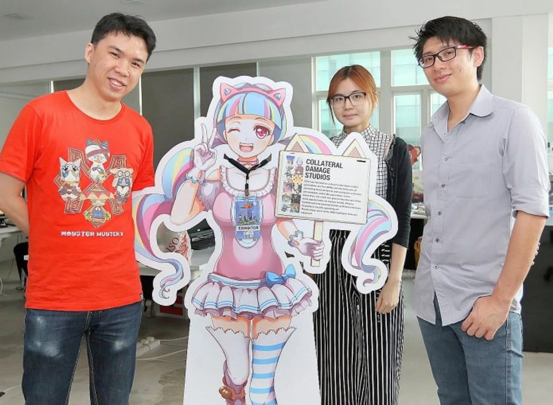 TEAM EFFORT: Collateral Damage Studios co-founder and general manager Ng Kian Chuan (right) and his team, Mr Low Zi Rong (left) and Ms Tan Hui Tian.