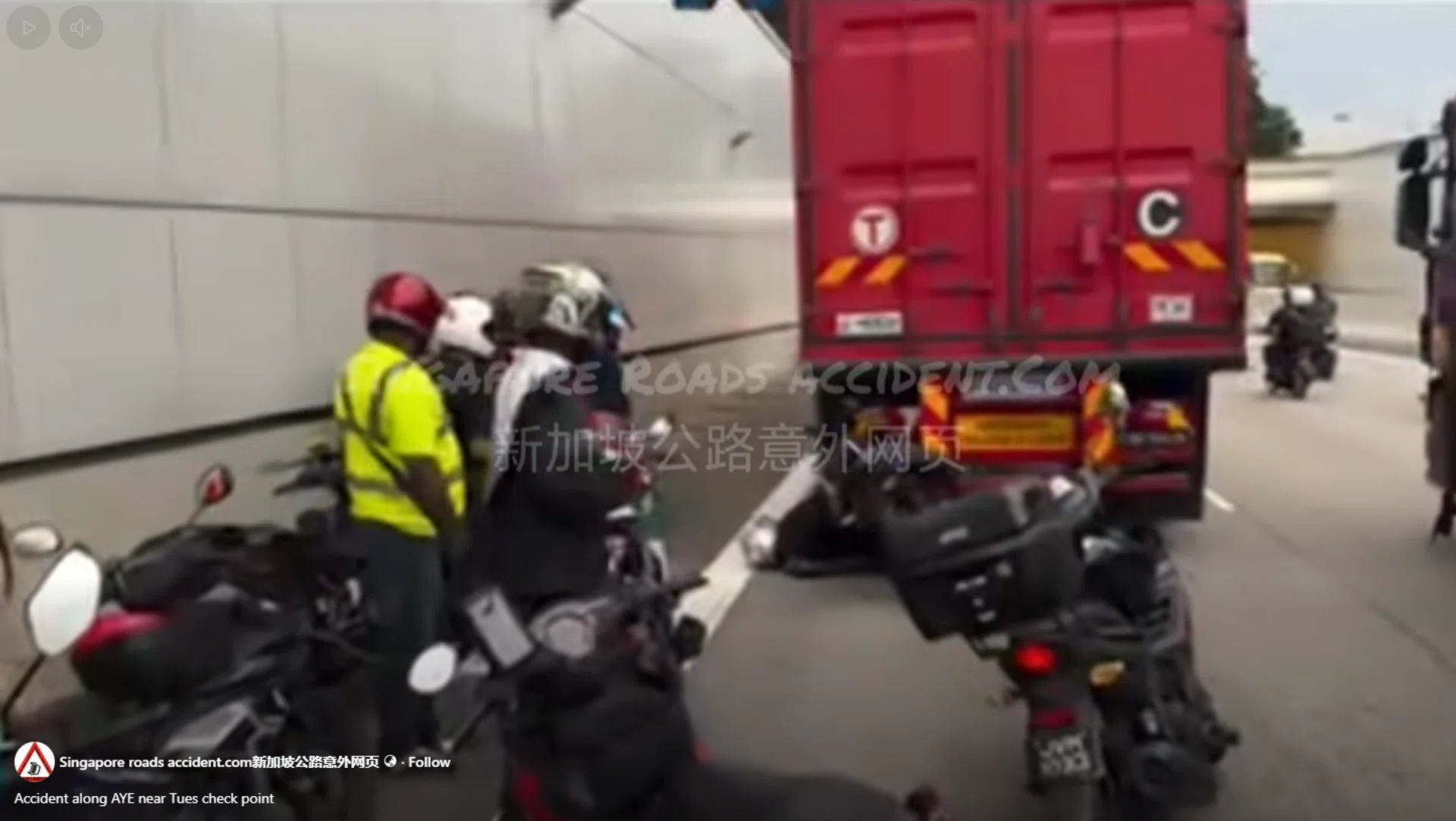 Videos on social media showed a motorcycle lodged in the back of a red trailer truck.