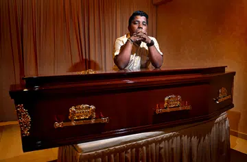 When foreign workers die, he sends them home