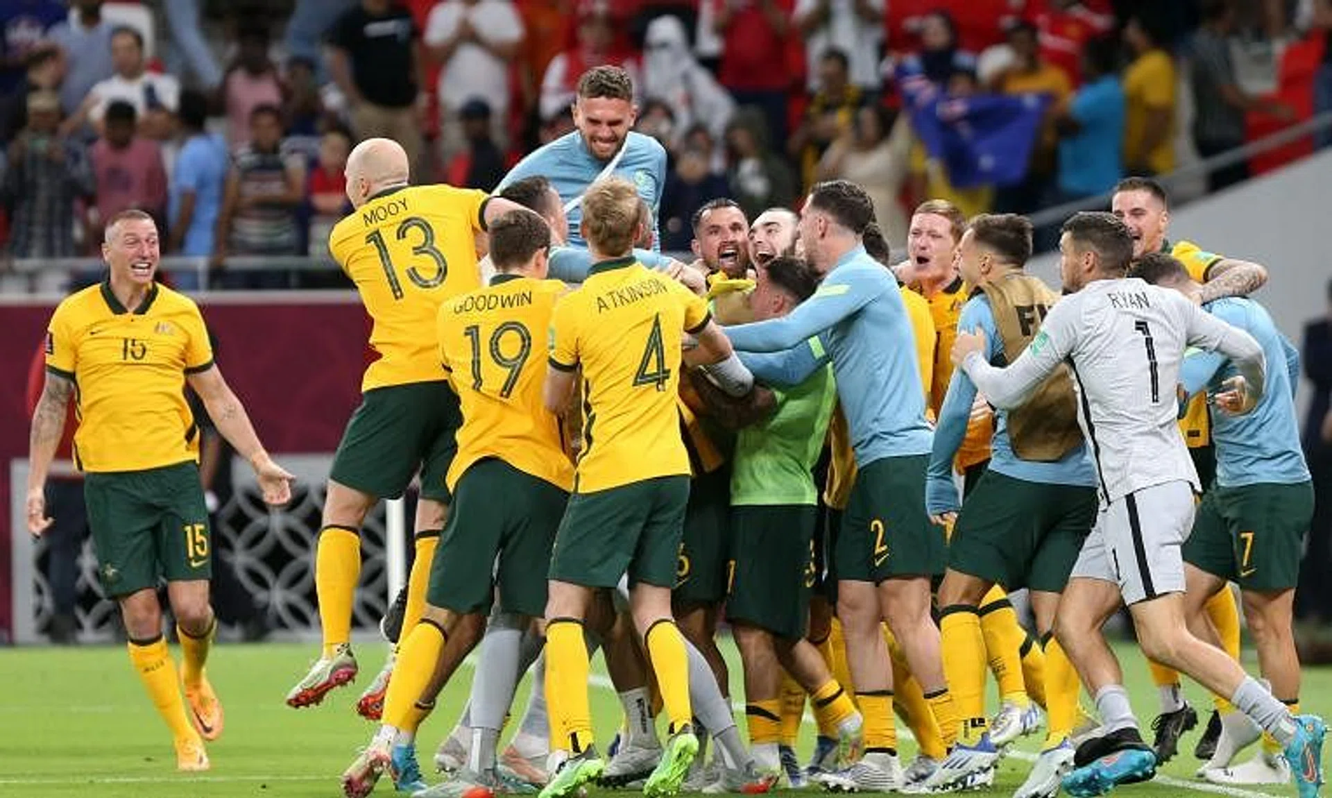 Australia's players celebrate winning the play-offs match against Peru on June 13, 2022.