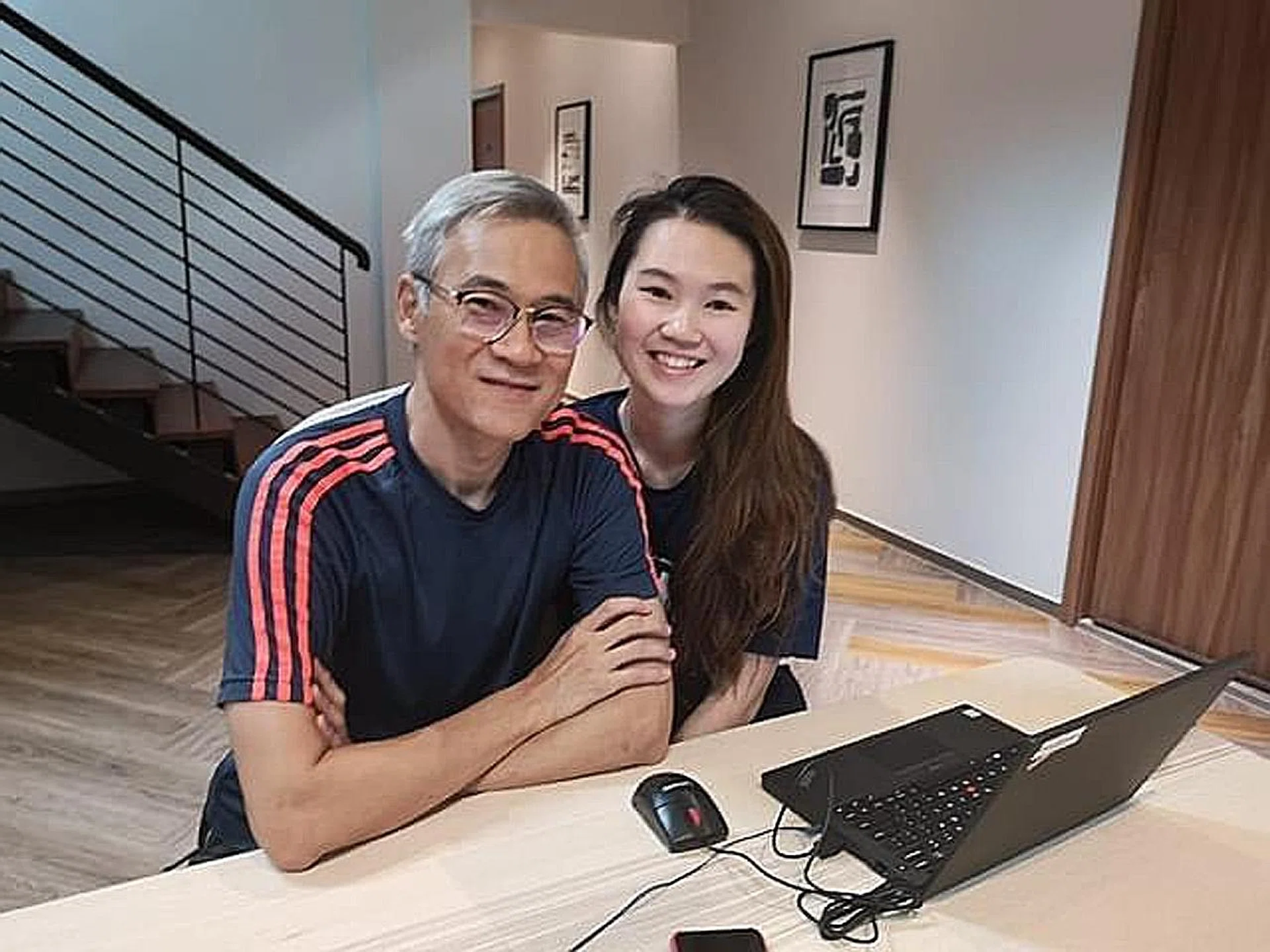 Miss Esabel Lee with her father, Mr Jason Lee. She was so worried about infecting her parents that she asked them to keep their distance. 