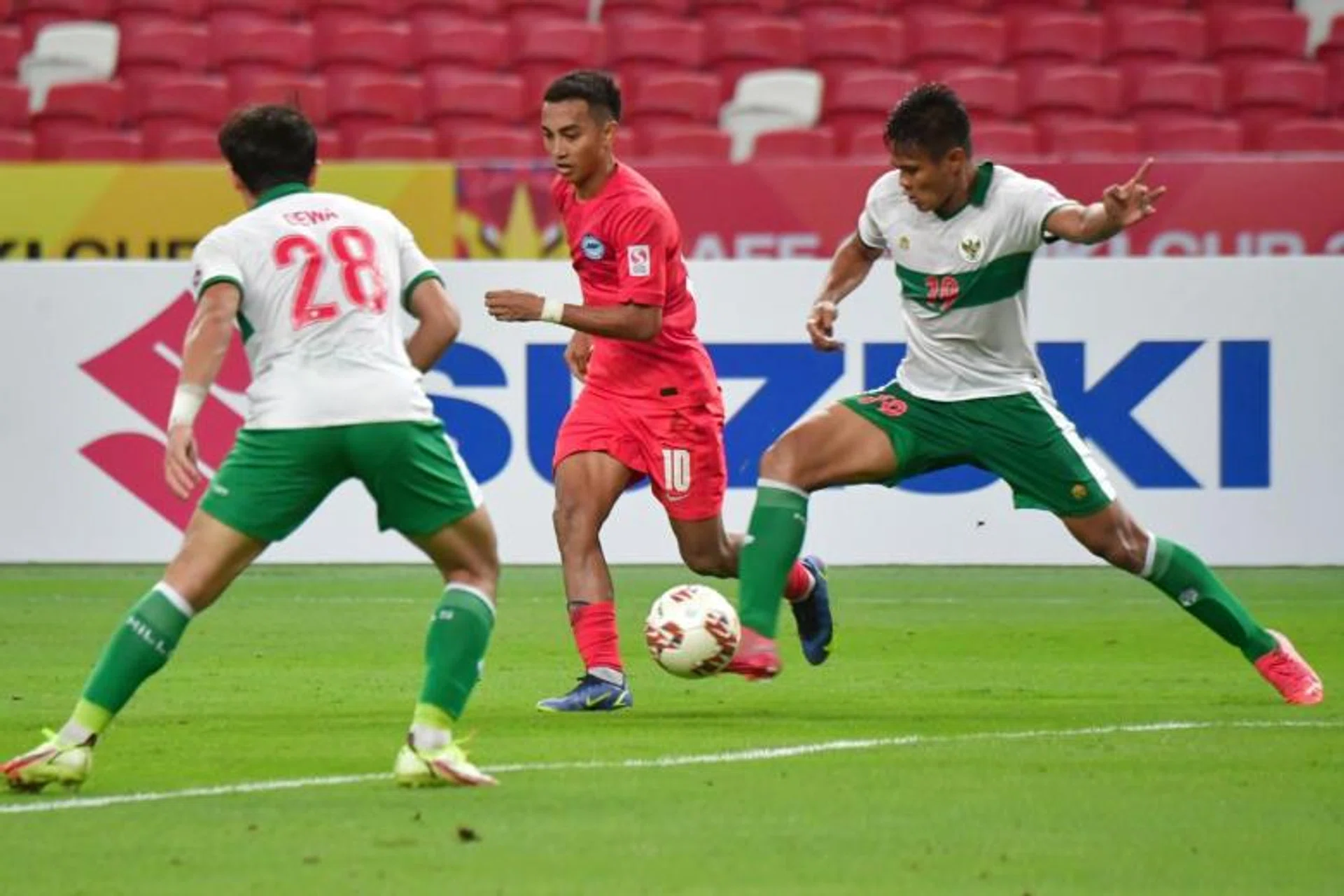 Faris Ramli (centre) in action during the first leg of the AFF Suzuki Cup semi-final against Indonesia on Dec 22, 2021.
