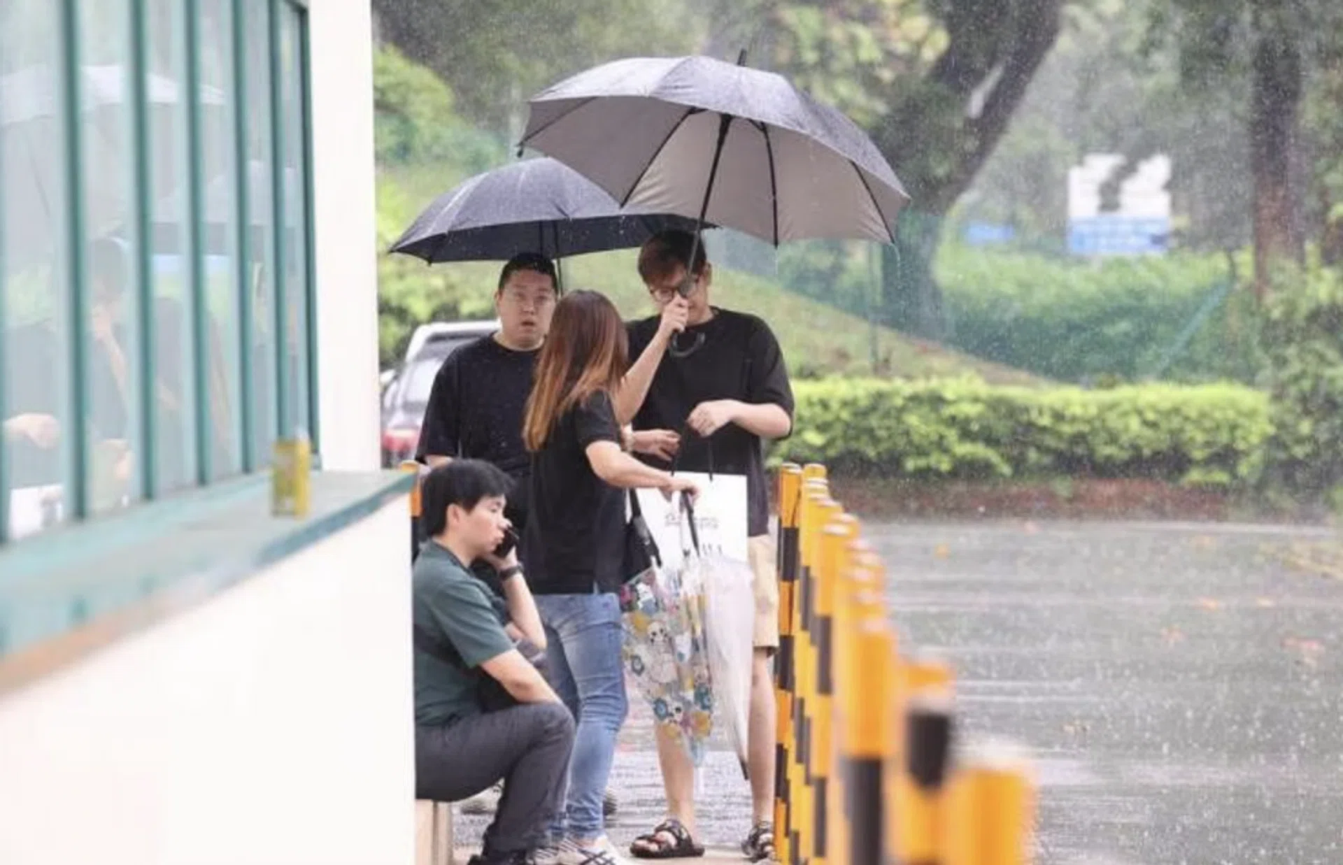 Mr Cai's sons outside the mortuary on May 7.
