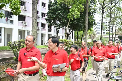 Singapore Democratic Party chief Chee Soo Juan (foreground, right) and party vice-chairman Bryan Lim leading a walkabout.