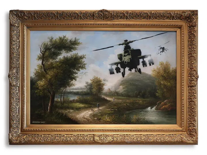 Vandalised Oils (Choppers) (est. £2.5-3.5 million) is seen as Banksy’s critique of the dangerous potentials of mechanised warfare (Photo credit: Sotheby's)