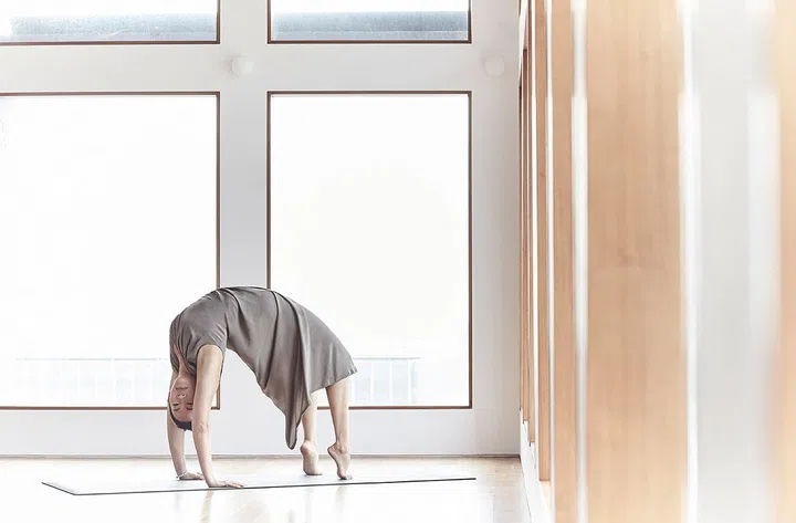 IN TOP FORMSmall class sizes at The Yoga School allow teachers to better monitor the postural alignment of each student.