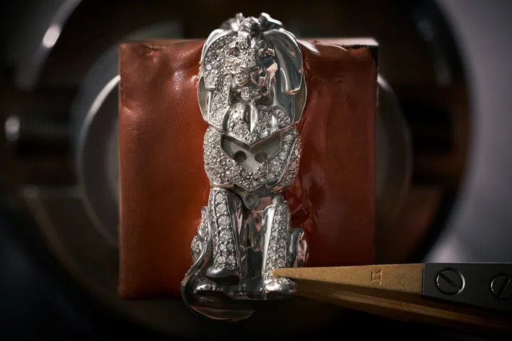 White gold lion chess king from Chanel’s Coco Game chessboard, snow-set with hundreds of brilliant-cut diamonds and accented with black lacquer details, standing on a ceramic and diamond-set base.