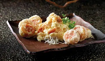 Sauteed fresh milk crab meat and egg white accompanied with deep fried pork rolls with preserved bean curd