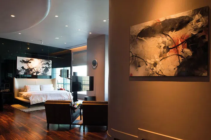 The master bedroom includes its own living space for lounging and watching TV, as well as a home office.