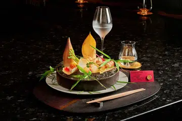 japanese tiger prawns meet hokkaido uni, finished with japanese butterbur and kinome in this exclusive off-menu creation by fine dining restaurant imamura singapore