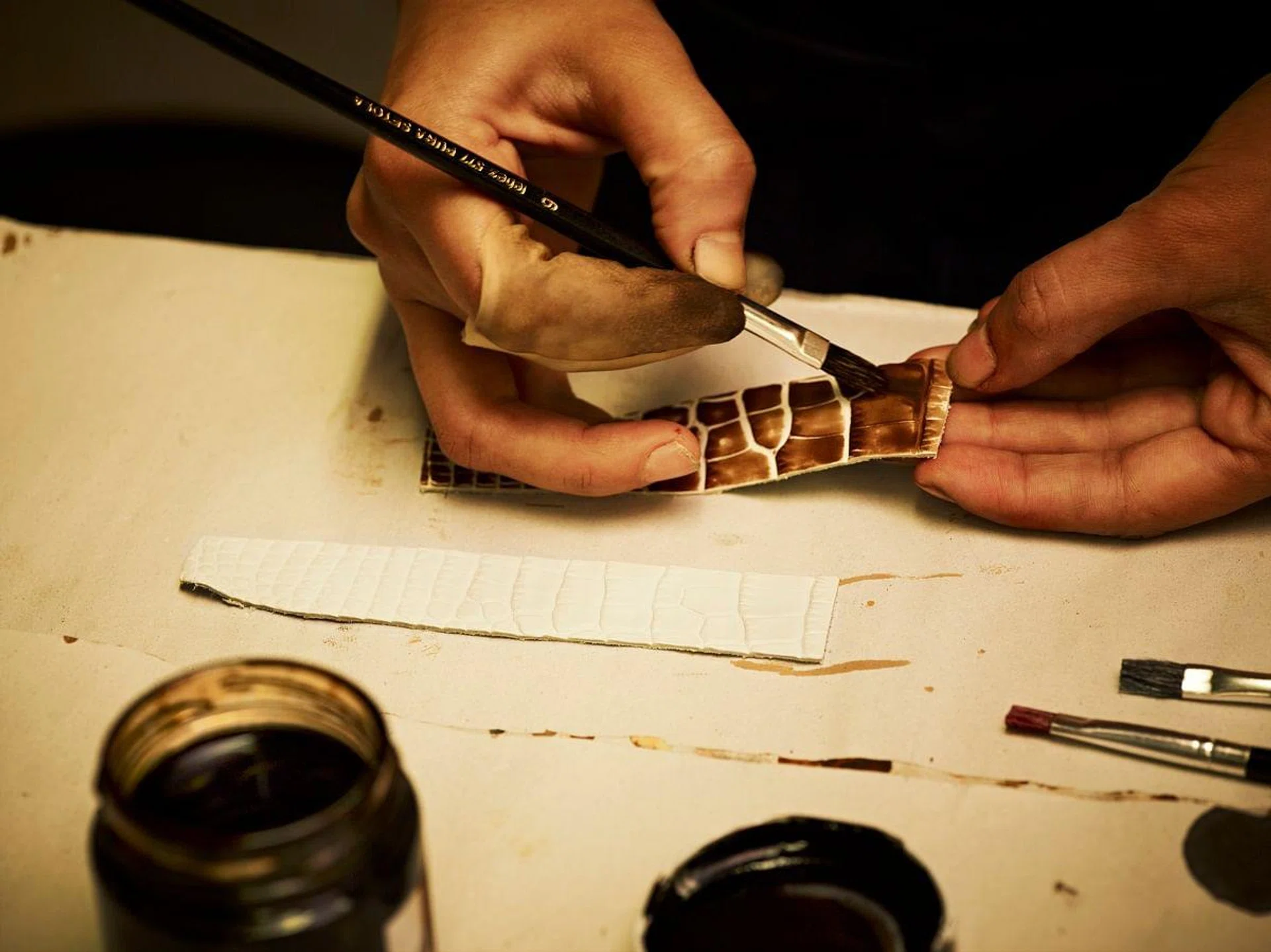 To accentuate the unique texture of the leather used for the IWC watch straps, Santoni also retraces the pattern with a fine paintbrush. (PHOTOPRESS/IWC)